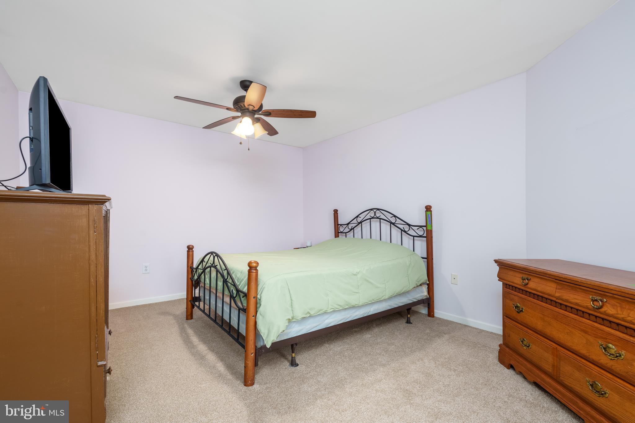 1305 Independence Way Newark, DE 19713 - Photo 9 of 25 a bedroom with a bed and a chandelier