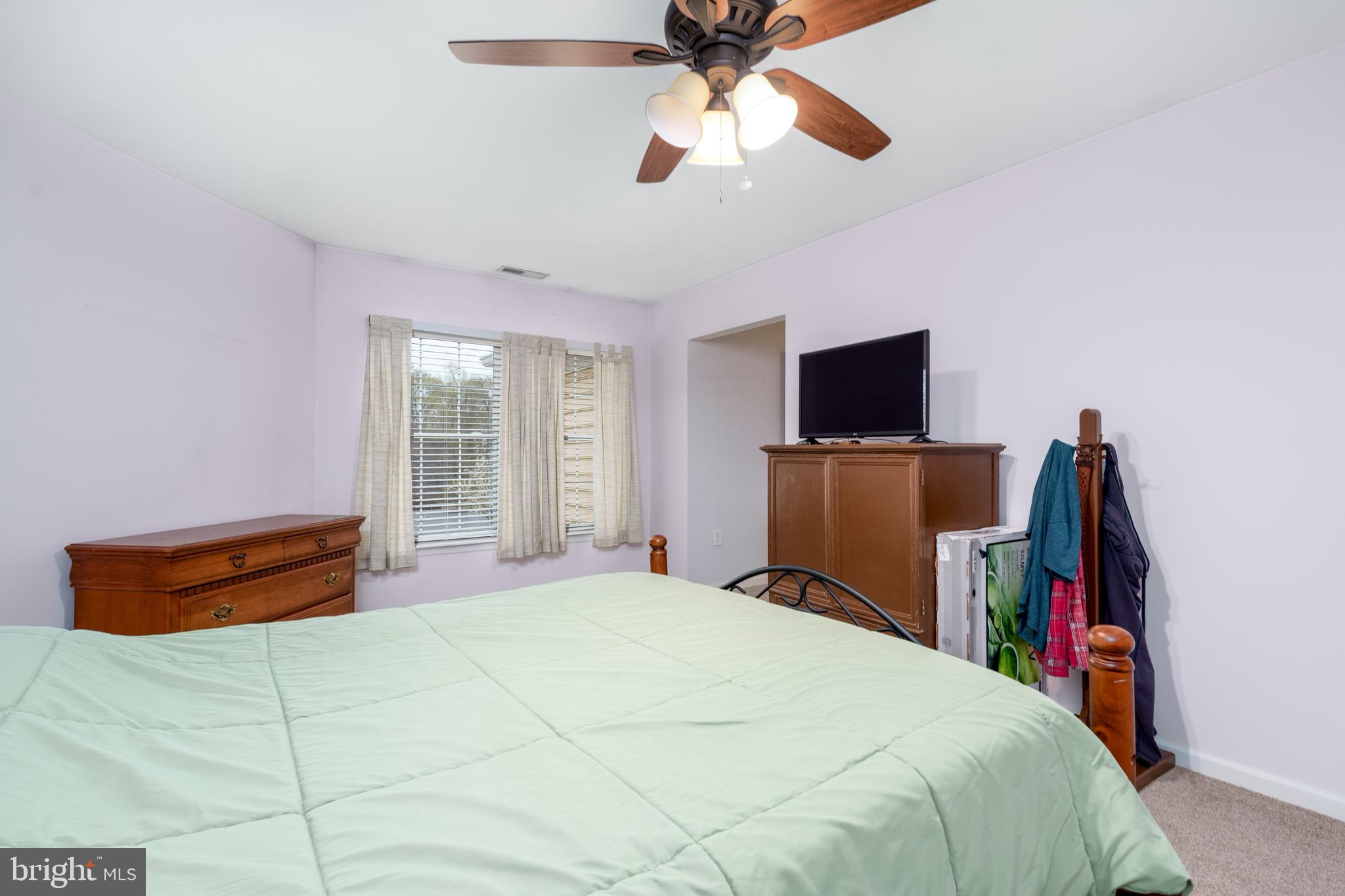 1305 Independence Way Newark, DE 19713 - Photo 10 of 25 a bedroom with a bed and a flat screen tv