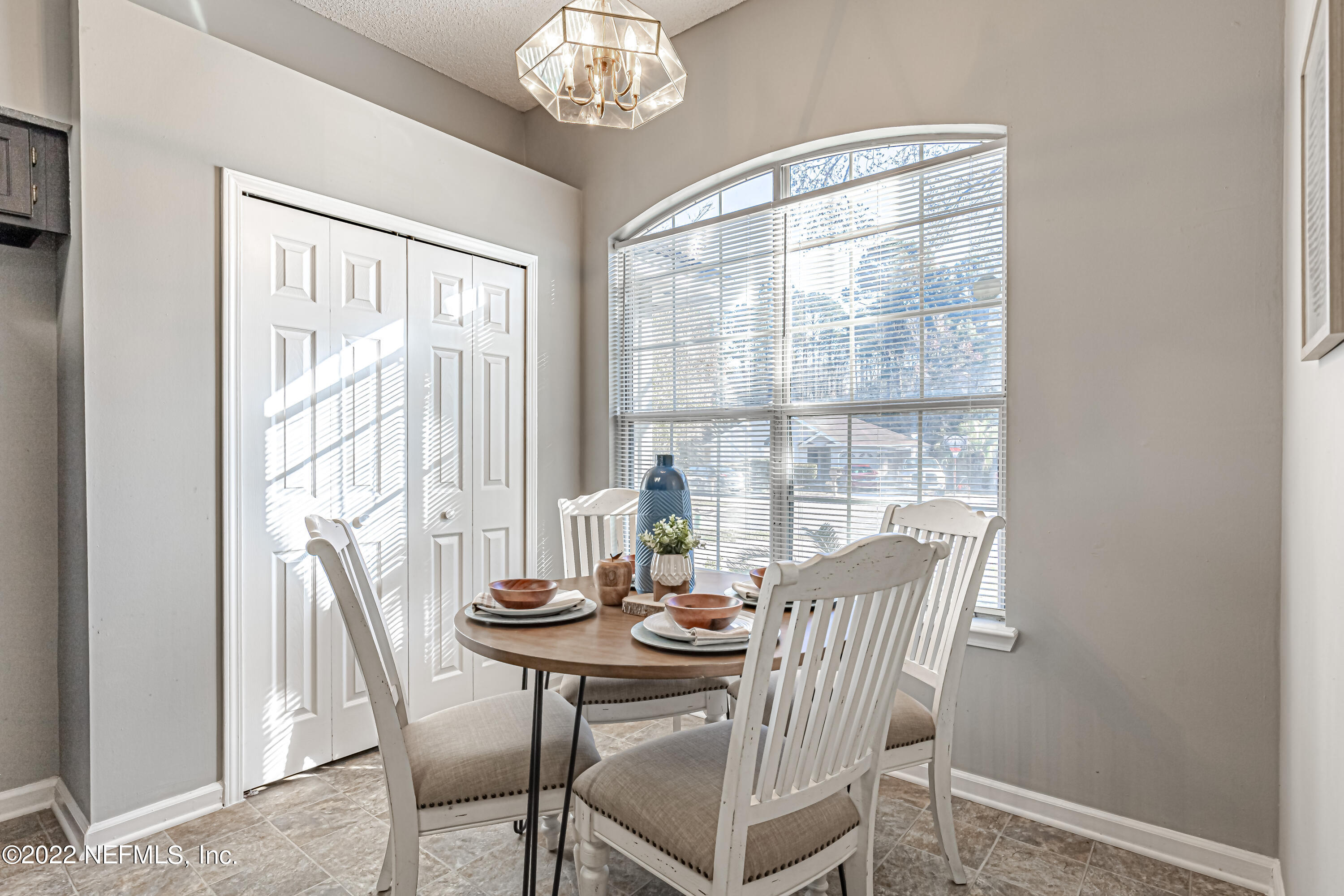 7696 Enderby Avenue East Jacksonville, FL 32244 - Photo 14 of 35 a view of a dining room with furniture window and outside view