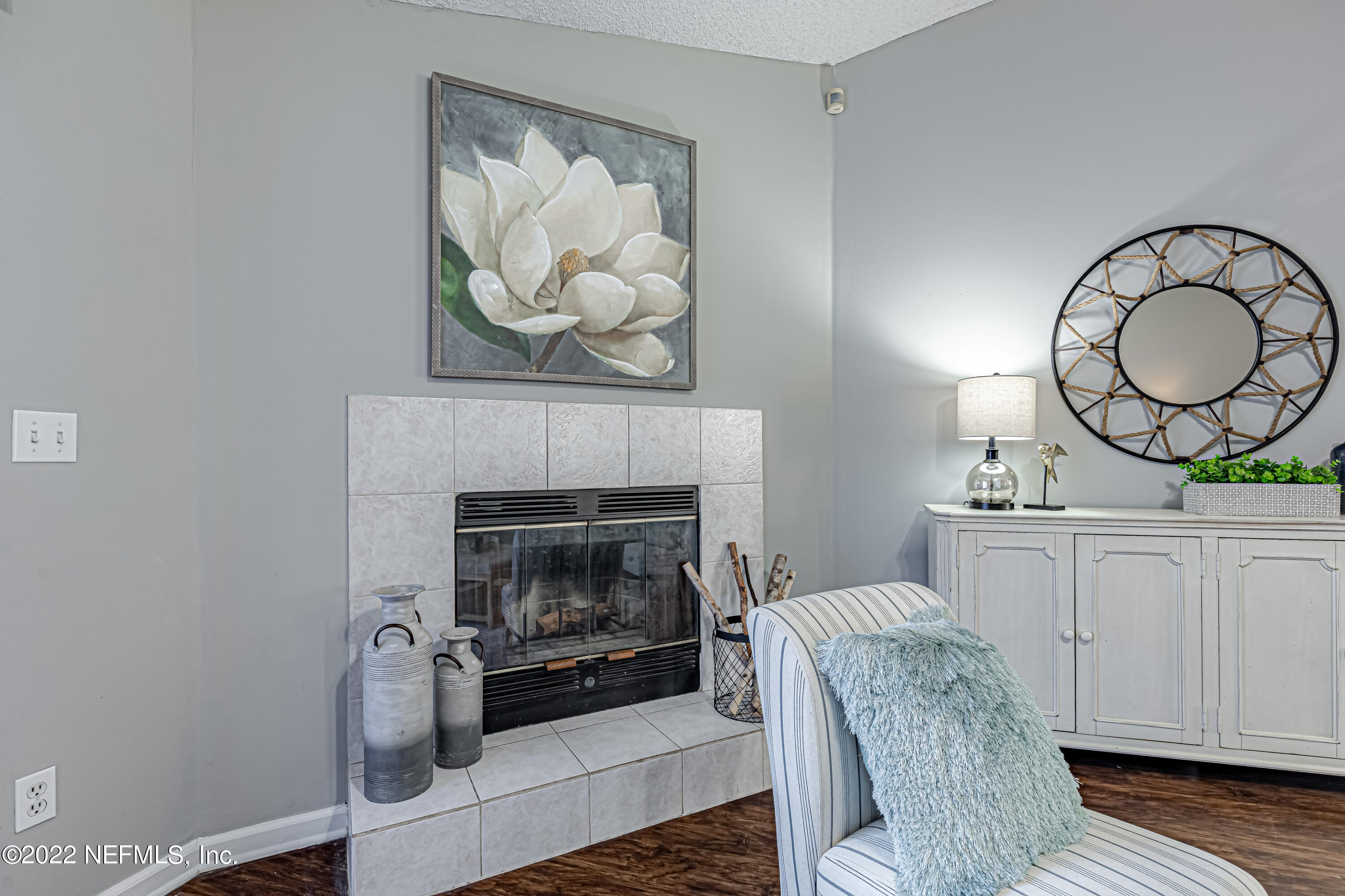 7696 Enderby Avenue East Jacksonville, FL 32244 - Photo 17 of 35 a living room with furniture and a fireplace