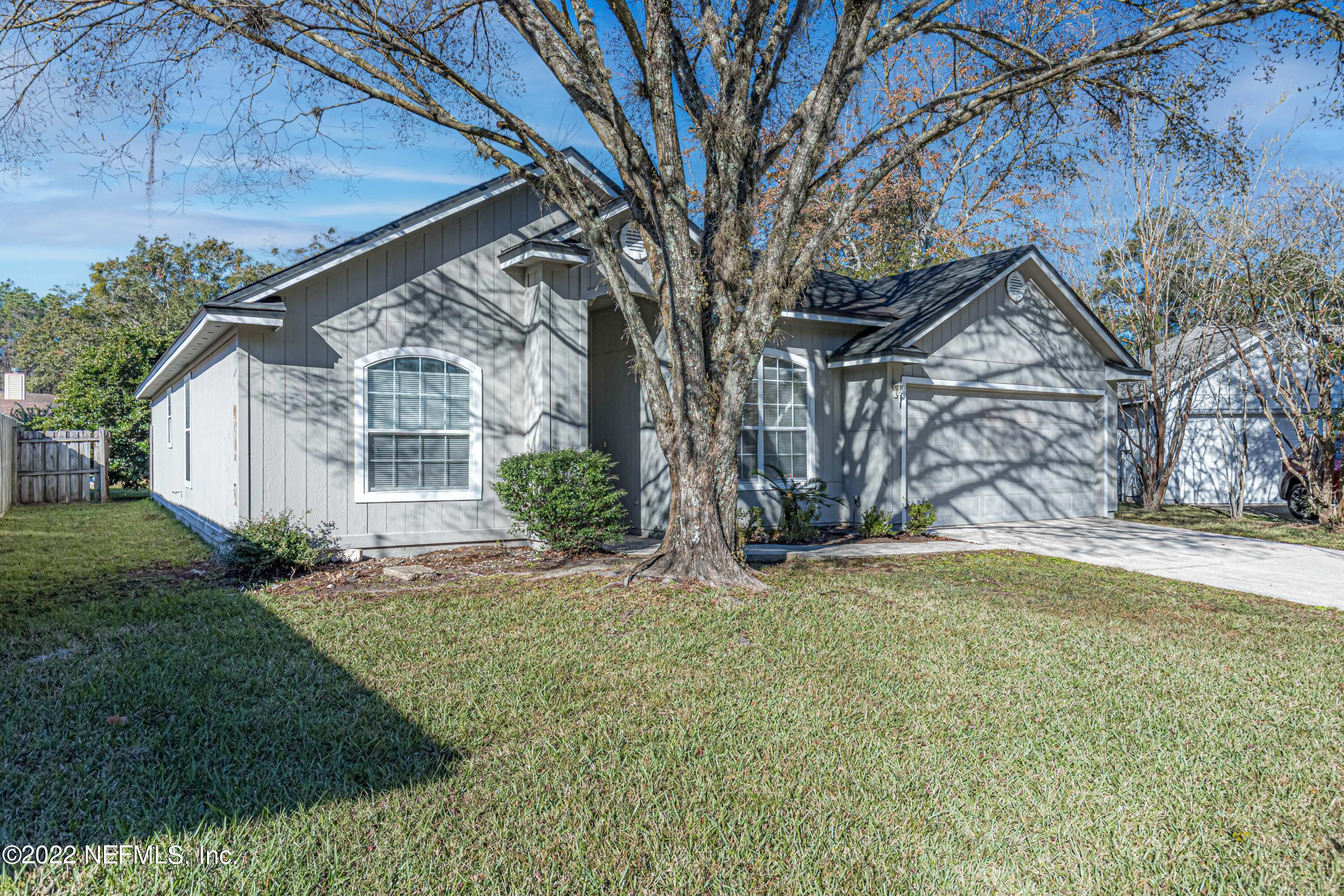 7696 Enderby Avenue East Jacksonville, FL 32244 - Photo 2 of 35 a house with garden in front of it