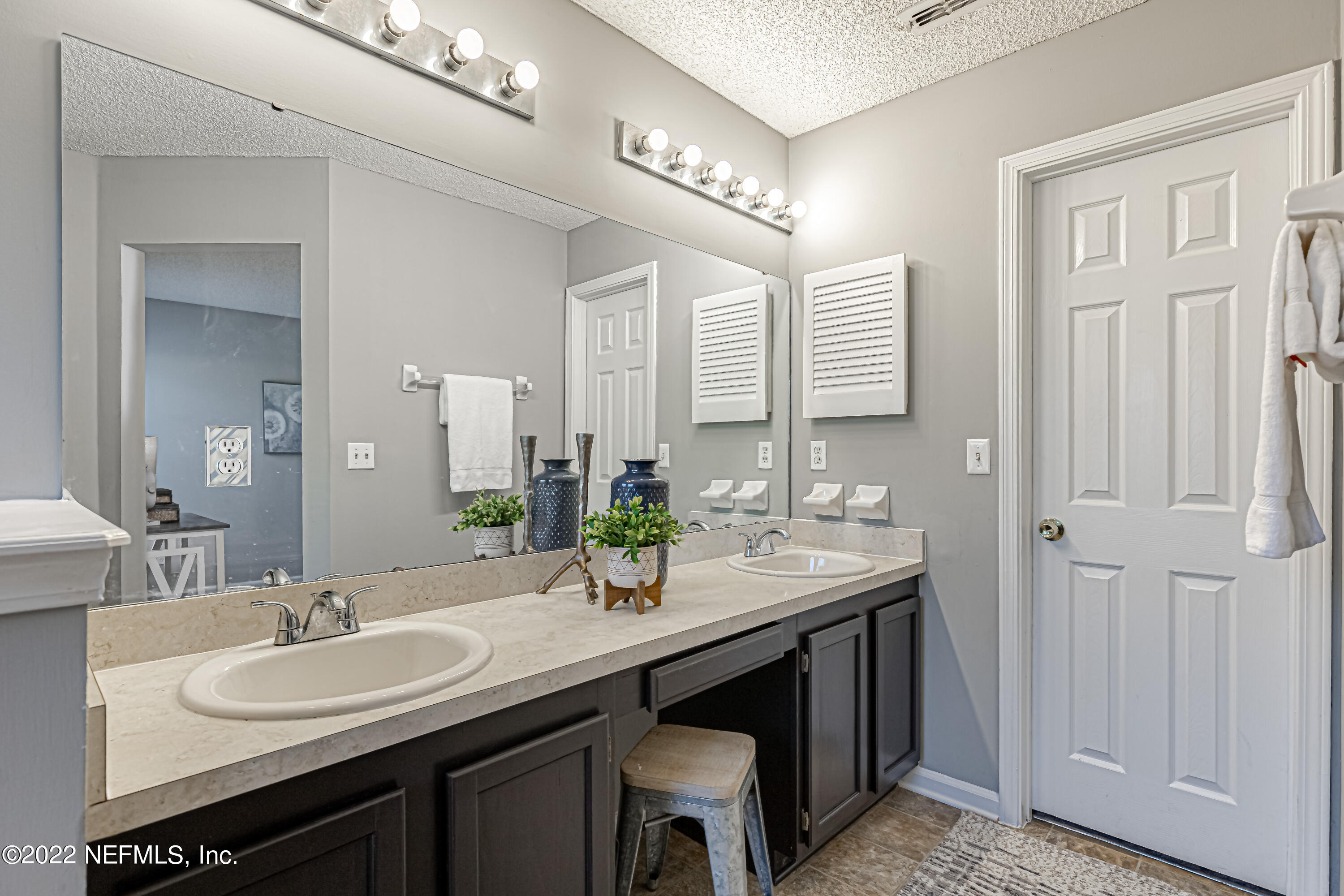 7696 Enderby Avenue East Jacksonville, FL 32244 - Photo 26 of 35 a bathroom with a sink double vanity and a mirror