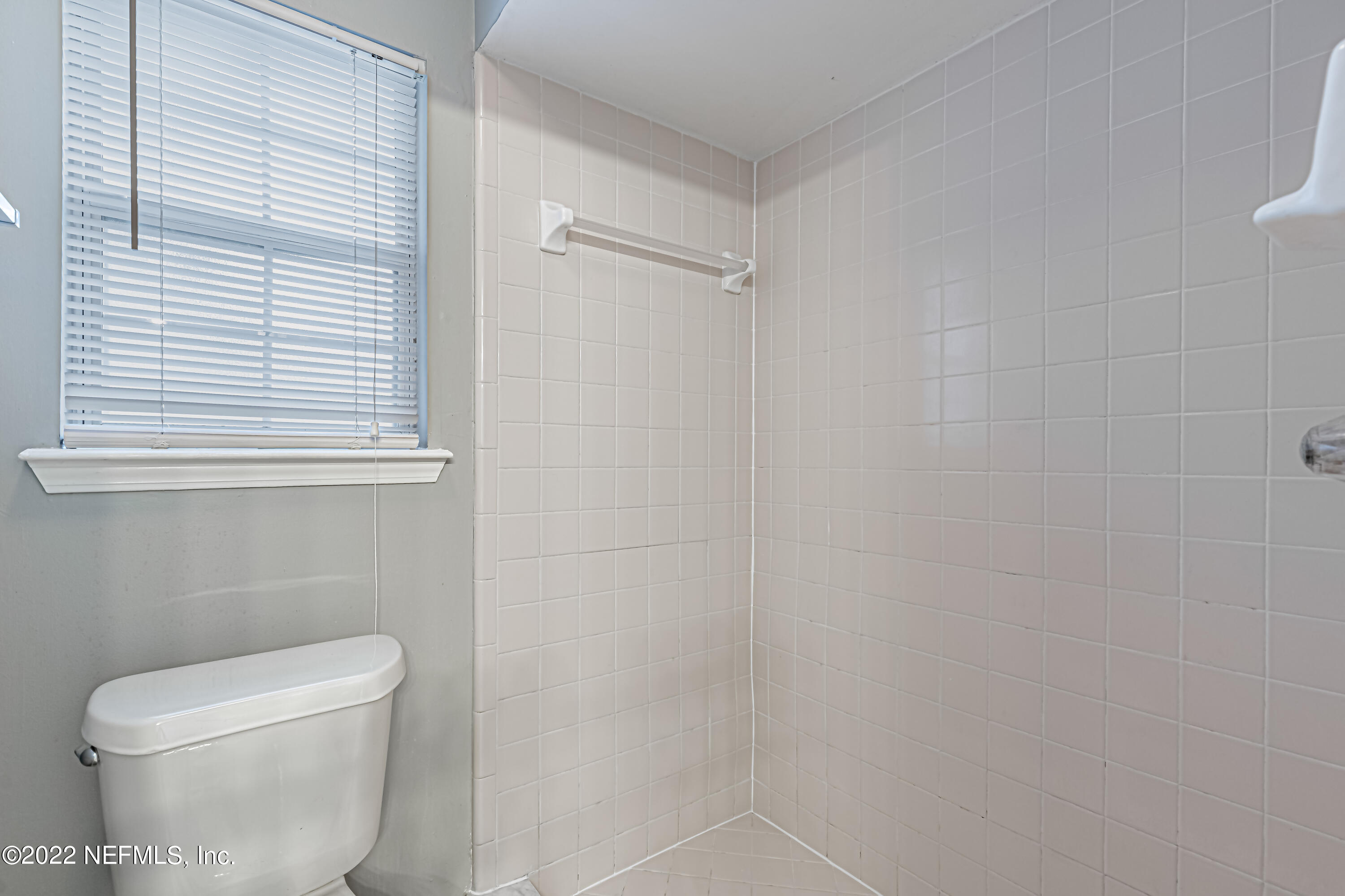 7696 Enderby Avenue East Jacksonville, FL 32244 - Photo 28 of 35 a white toilet sitting next to a white cabinet