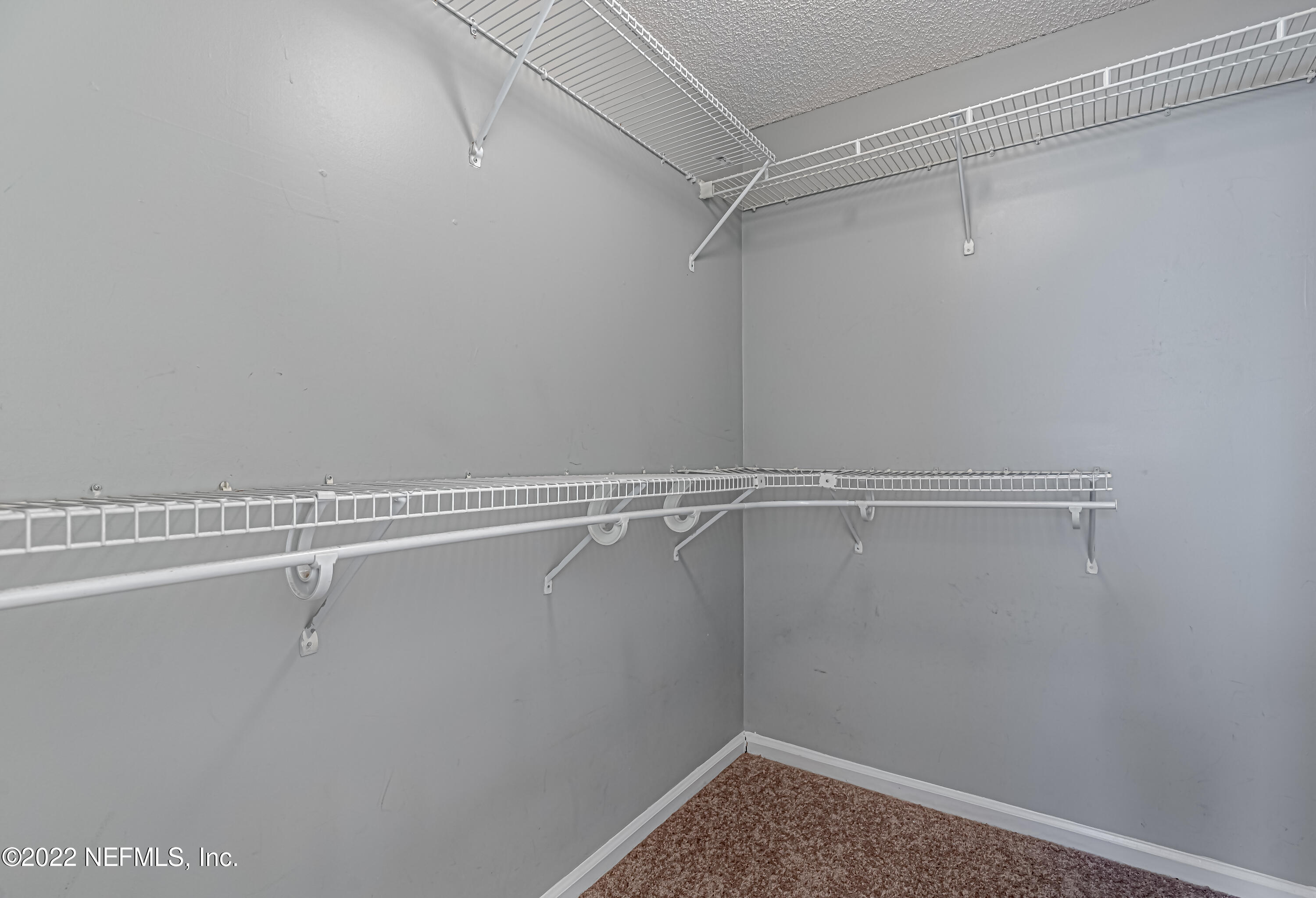 7696 Enderby Avenue East Jacksonville, FL 32244 - Photo 29 of 35 a view of a room with racks on the wall