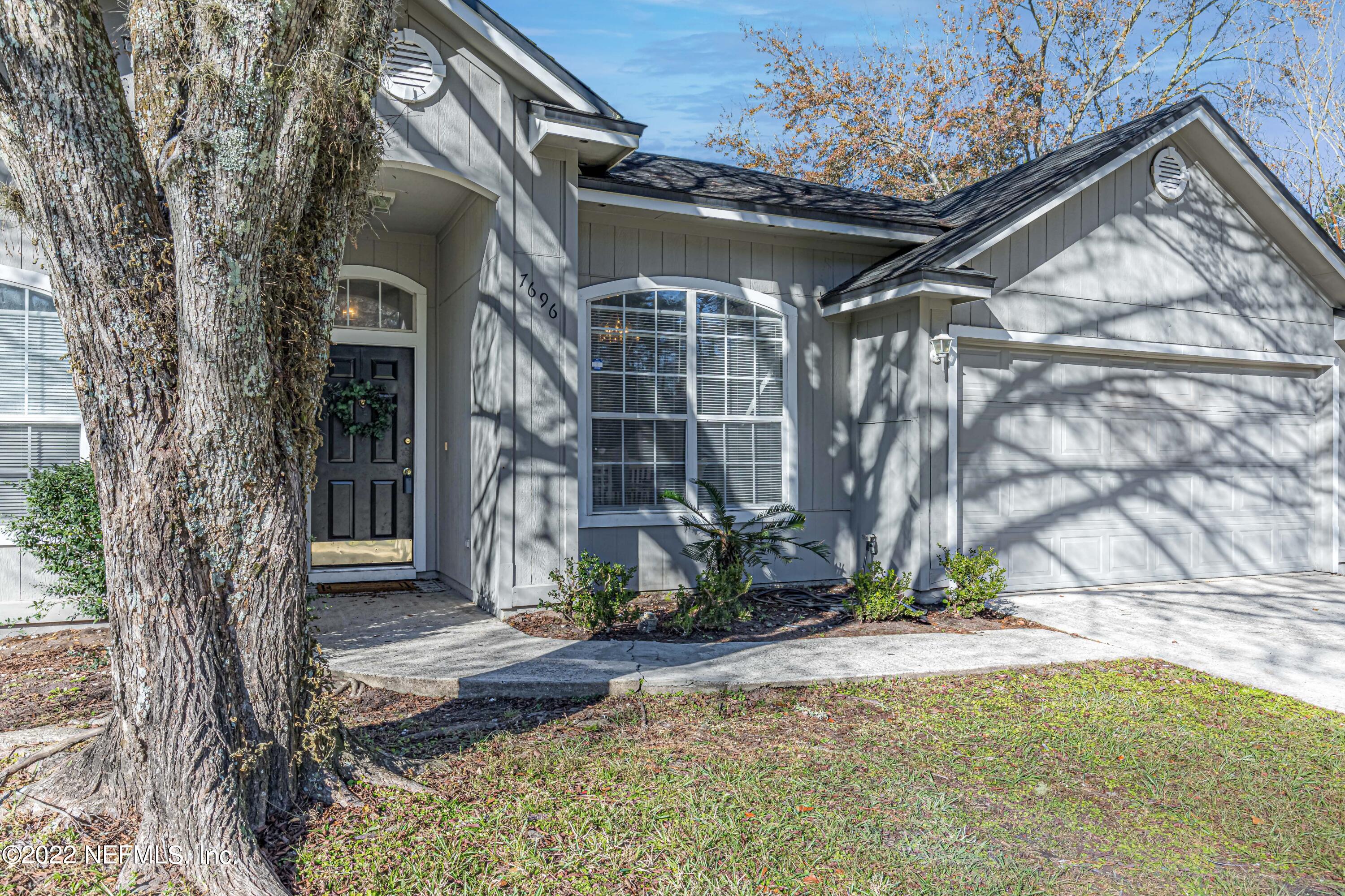 7696 Enderby Avenue East Jacksonville, FL 32244 - Photo 4 of 35 a view of a house with a yard