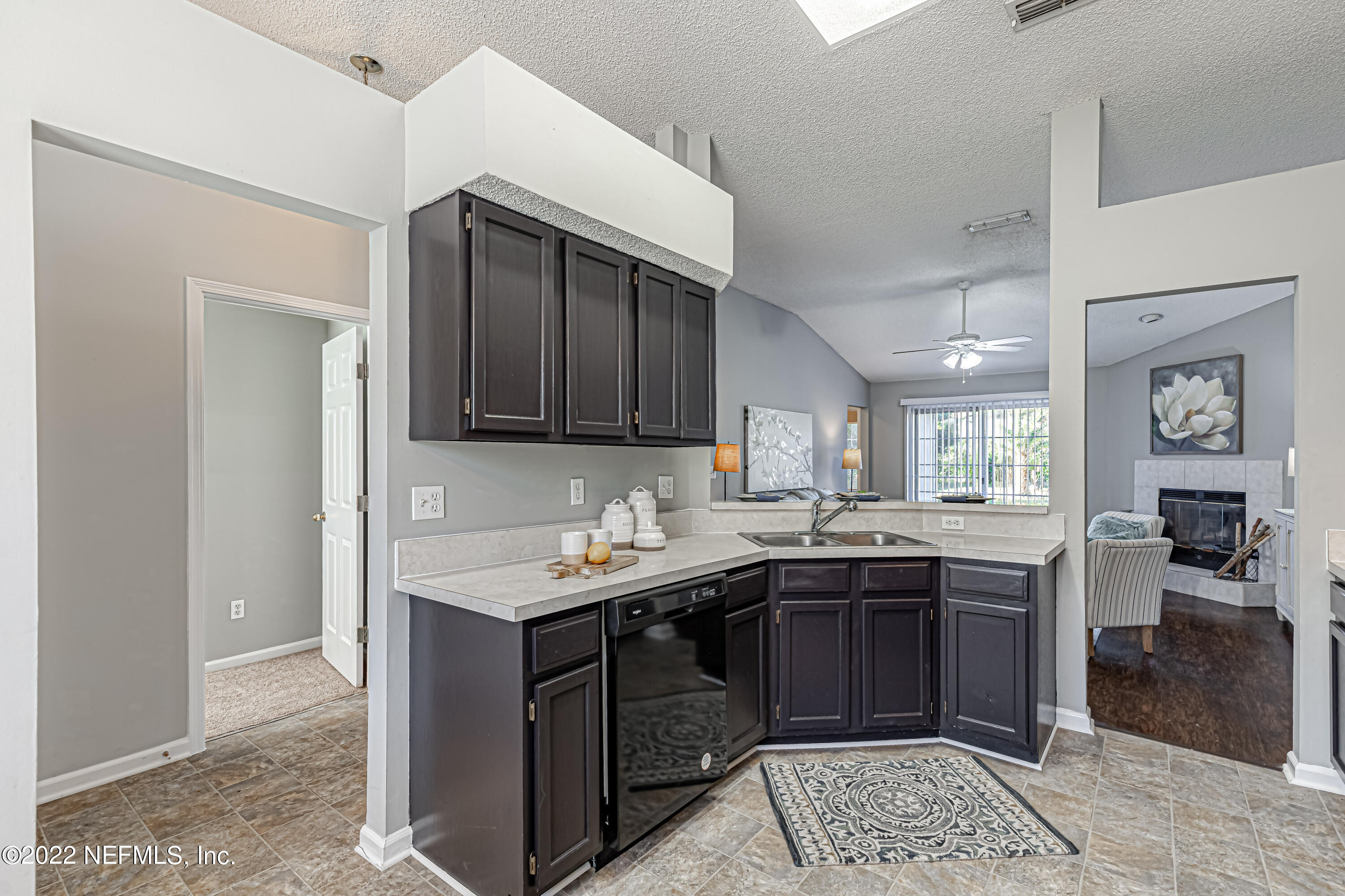 7696 Enderby Avenue East Jacksonville, FL 32244 - Photo 9 of 35 a kitchen with a sink and cabinets