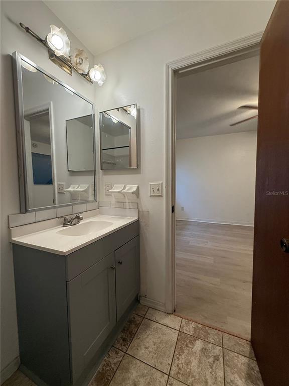 7200 Southwest 8th Avenue, Unit T128 Gainesville, FL 32607 - Photo 33 of 38 a bathroom with a sink and a mirror