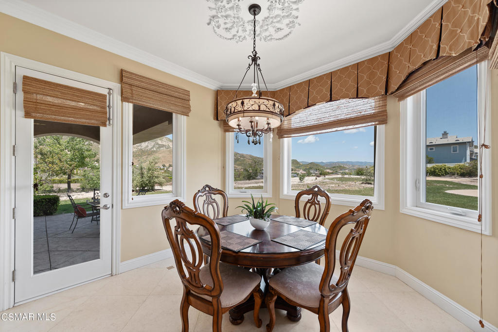 2462 Lost Canyons Drive Simi Valley, CA 93065 - Photo 16 of 50 a view of a dining room with furniture large windows and wooden floor