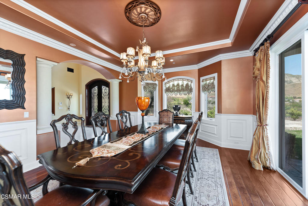2462 Lost Canyons Drive Simi Valley, CA 93065 - Photo 18 of 50 a view of a dining room with furniture a chandelier and wooden floor