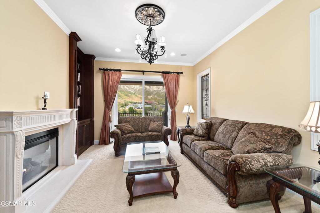 2462 Lost Canyons Drive Simi Valley, CA 93065 - Photo 32 of 50 a living room with furniture and a fireplace