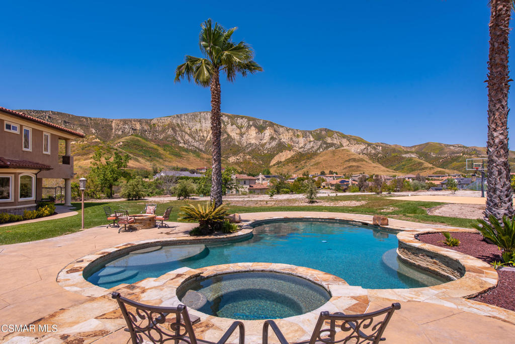 2462 Lost Canyons Drive Simi Valley, CA 93065 - Photo 41 of 50 a view of swimming pool with a table and chairs