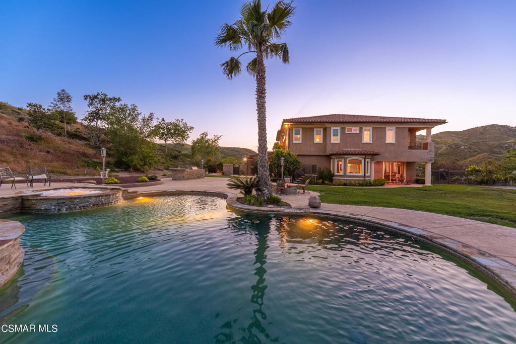 2462 Lost Canyons Drive Simi Valley, CA 93065 - Photo 43 of 50 a front view of a house with swimming pool having outdoor seating