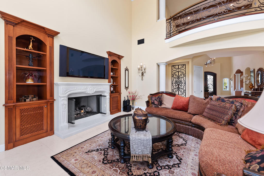 2462 Lost Canyons Drive Simi Valley, CA 93065 - Photo 8 of 50 a living room with furniture a flat screen tv and a fireplace