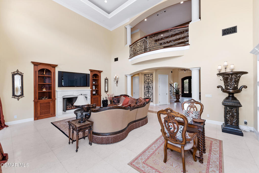 2462 Lost Canyons Drive Simi Valley, CA 93065 - Photo 9 of 50 a living room with furniture a flat screen tv and a fireplace