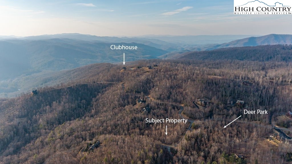 105 B Beaver Dam Road Elk Park, NC 28622 - Photo 4 of 31 a view of a dry yard with mountains in the background