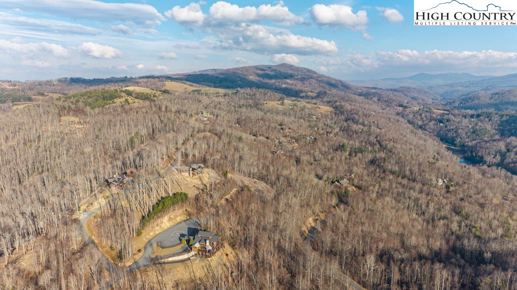 105 B Beaver Dam Road Elk Park, NC 28622 - Photo 9 of 31 a view of a dry yard with wooden fence