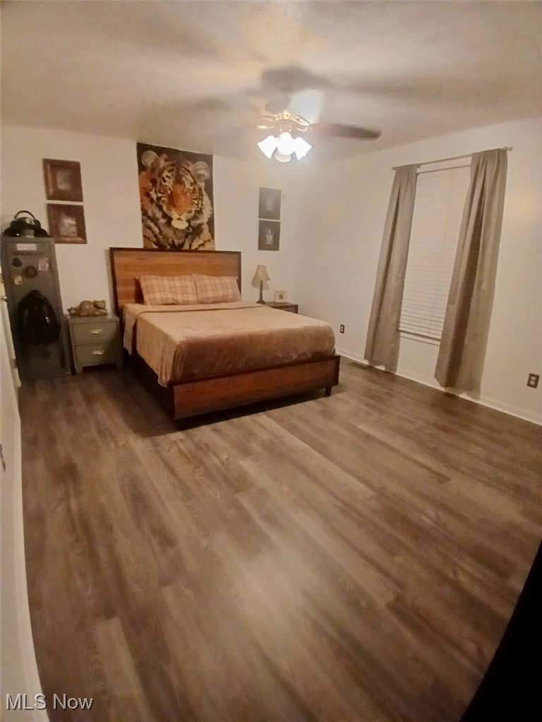 1685 Fattler Ridge Road Philo, OH 43771 - Photo 6 of 24 Bedroom featuring a ceiling fan and wood finished floors