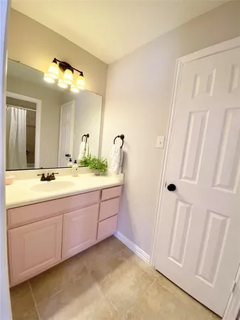 a bathroom with a double vanity sink and mirror