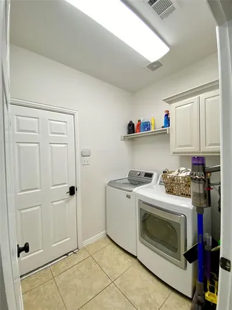 a kitchen with a stove and a cabinet