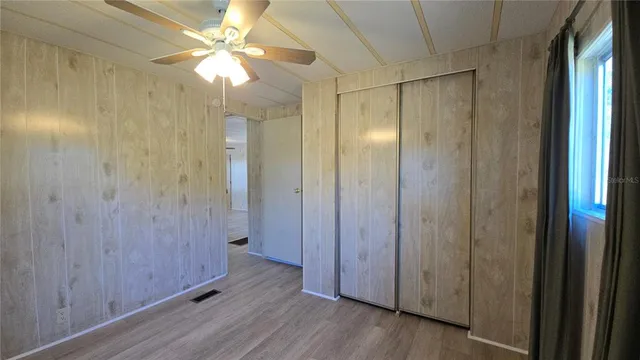 a view of a bathroom with a shower and a glass door