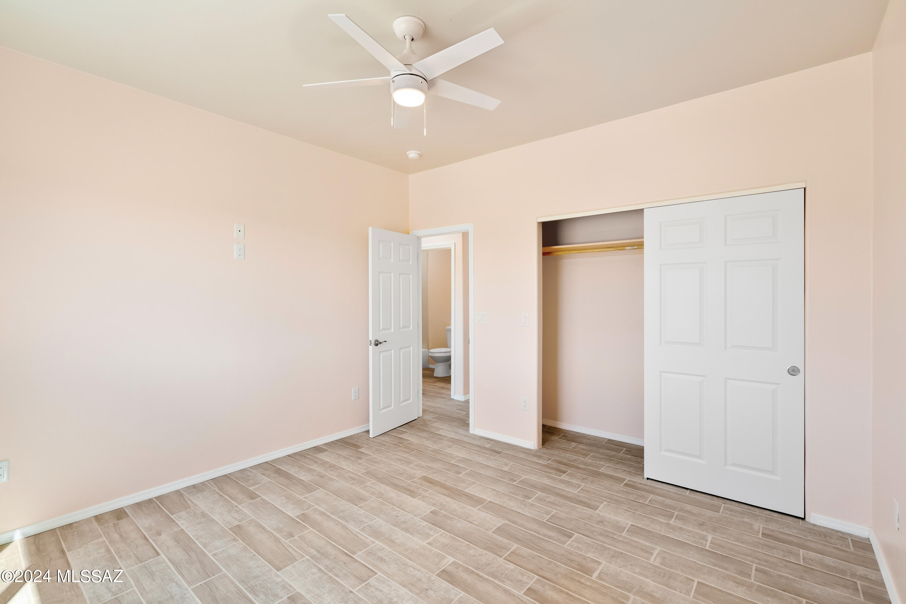 91 Avenida De Las Naciones Rio Rico, AZ 85648 - Photo 19 of 36 wooden floor in an empty room