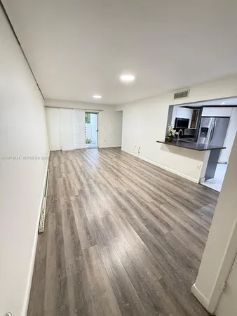 a room with a bed and a mirror