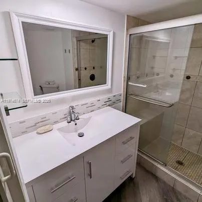 a bathroom with a sink and a mirror