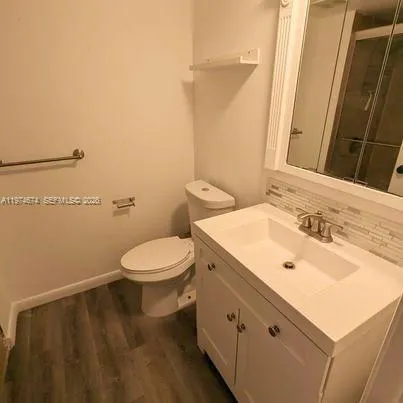 a bathroom with a sink and a toilet