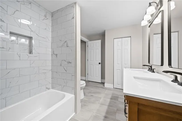 a bathroom with a bathtub and a sink