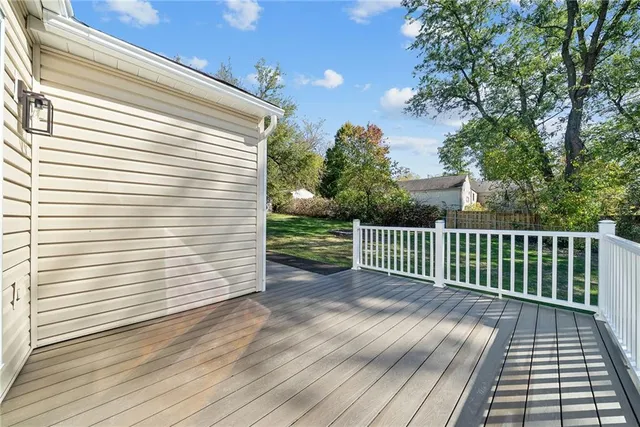 a view of a balcony with wooden floor
