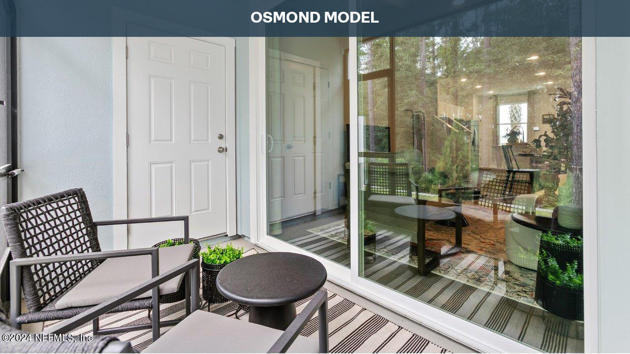 37 Crisanto Road St. Augustine, FL 32084 - Photo 36 of 53 a balcony with table and chairs