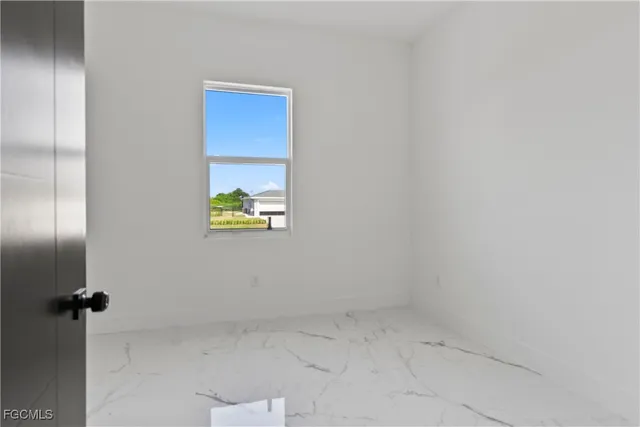 a view of a hallway with wooden cabinets