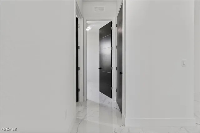 a view of a bathroom with a sink and mirror
