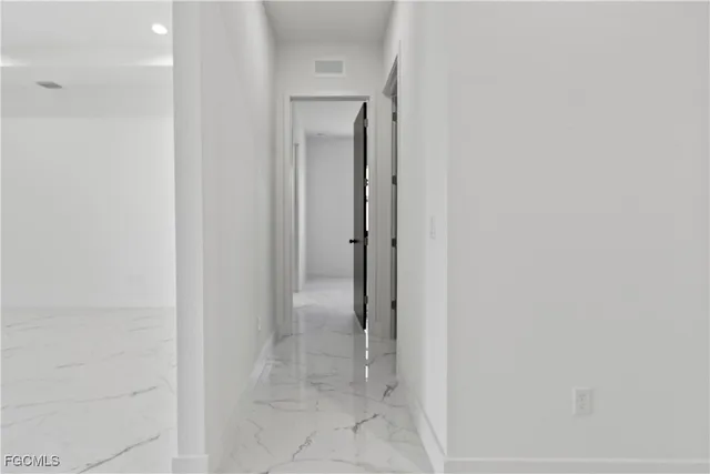 a bathroom with a toilet sink and shower