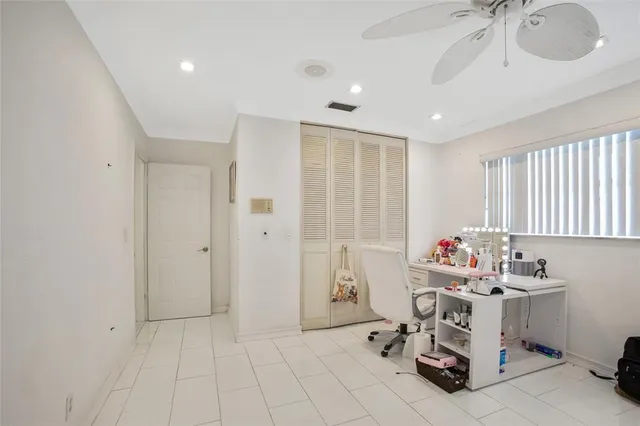 a car parked in front of white house