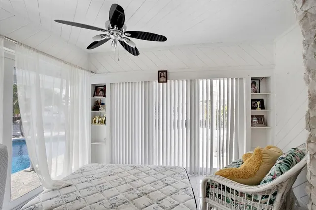a kitchen with kitchen island a counter top space a sink stainless steel appliances and cabinets