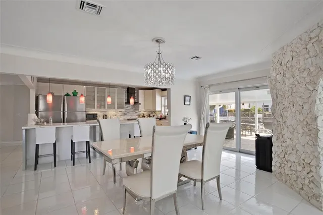 a kitchen with stainless steel appliances a sink stove and microwave
