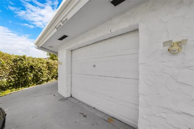 a bedroom with a large bed and a large window
