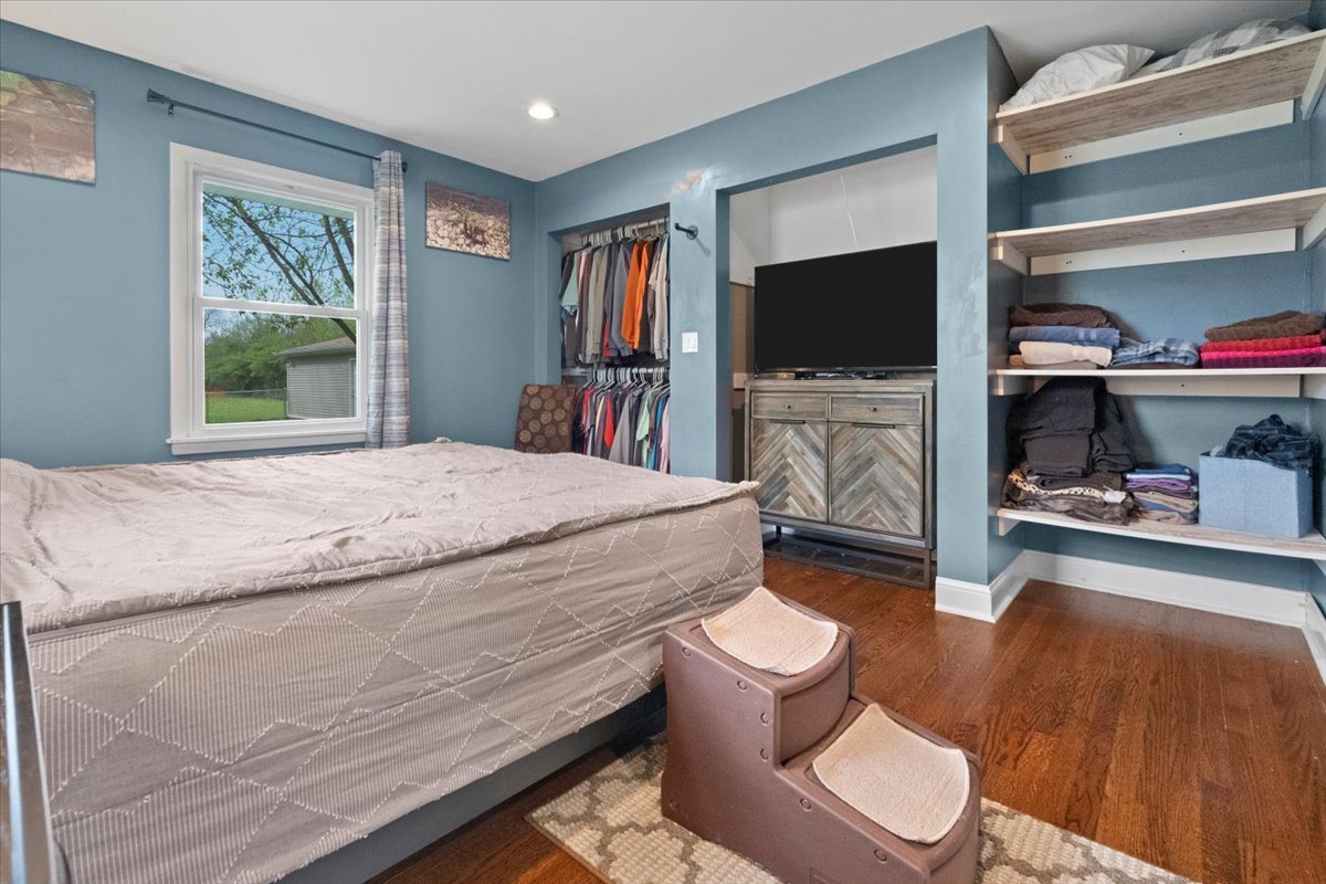 2517 Salem Boulevard Zion, IL 60099 - Photo 15 of 32 a bedroom with a bed and a flat screen tv