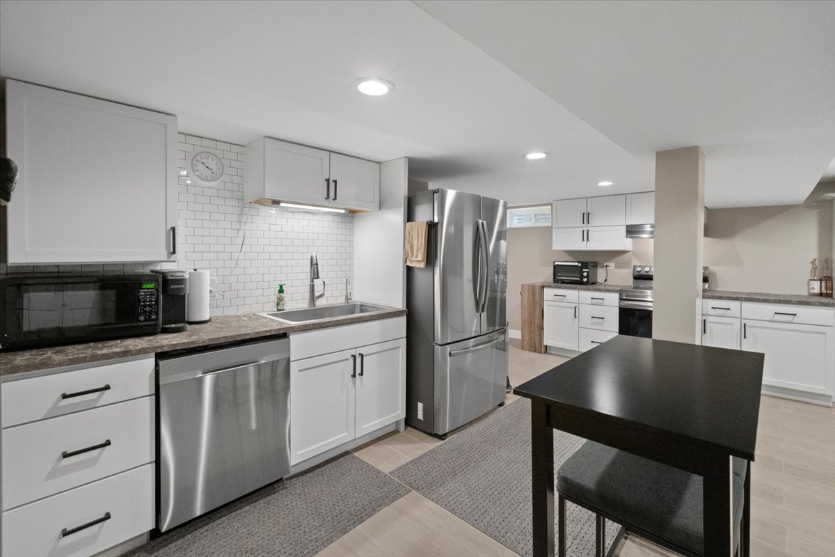 2517 Salem Boulevard Zion, IL 60099 - Photo 27 of 32 a kitchen with refrigerator cabinets and furniture
