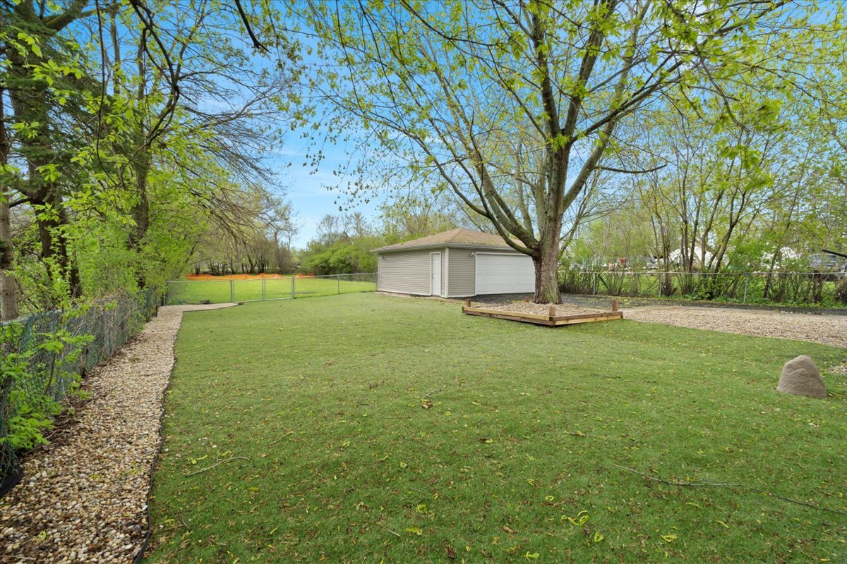 2517 Salem Boulevard Zion, IL 60099 - Photo 29 of 32 a view of a house with backyard and tree