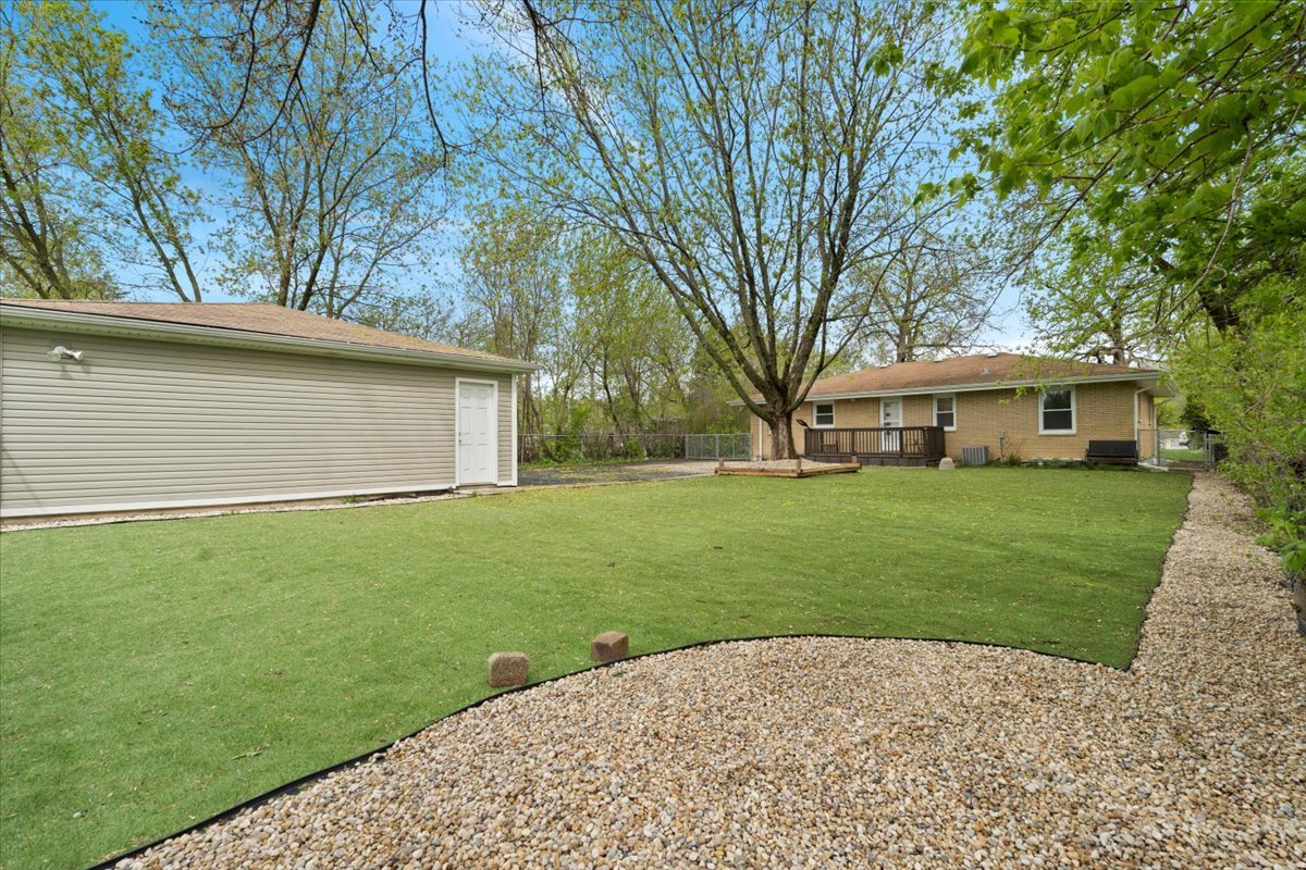 2517 Salem Boulevard Zion, IL 60099 - Photo 31 of 32 a front view of a house with a garden