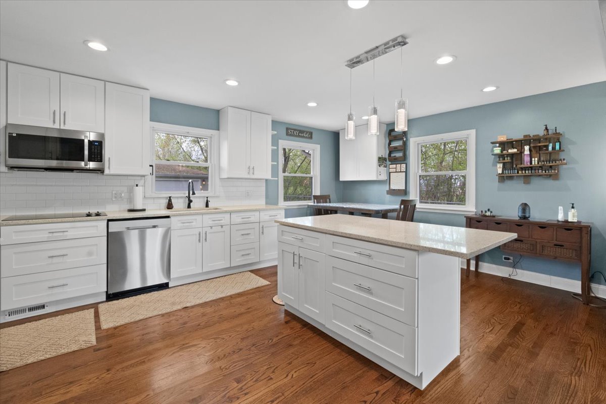 2517 Salem Boulevard Zion, IL 60099 - Photo 6 of 32 a kitchen with stainless steel appliances sink cabinets and wooden floor