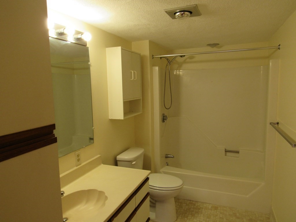 8 Nahant Place, Unit 202 Lynn, MA 01902 - Photo 15 of 24 a bathroom with a sink toilet and shower