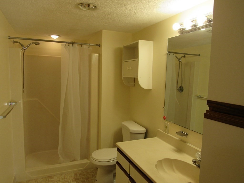 8 Nahant Place, Unit 202 Lynn, MA 01902 - Photo 19 of 24 a bathroom with a sink toilet and shower