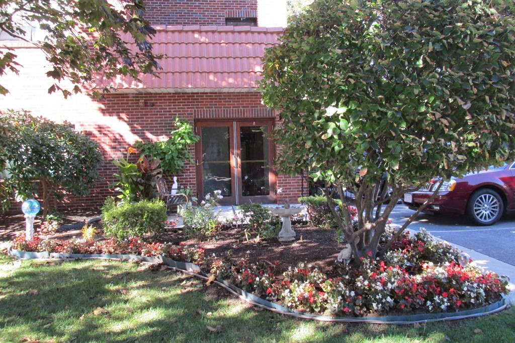 8 Nahant Place, Unit 202 Lynn, MA 01902 - Photo 2 of 24 a front view of a house with garden