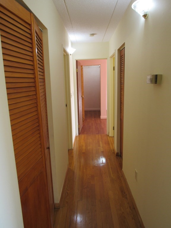 8 Nahant Place, Unit 202 Lynn, MA 01902 - Photo 8 of 24 a view of hallway with wooden floor