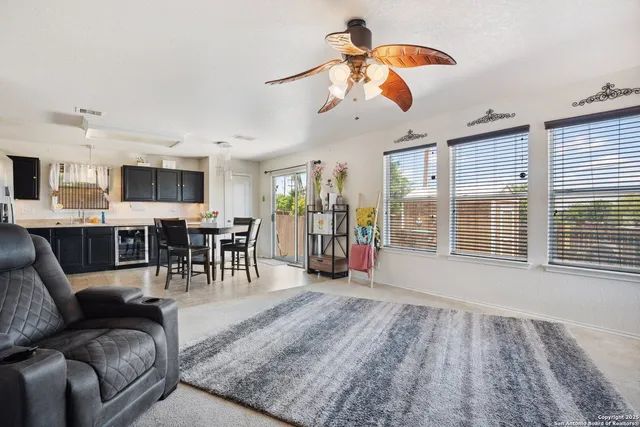 a living room with furniture and a large window