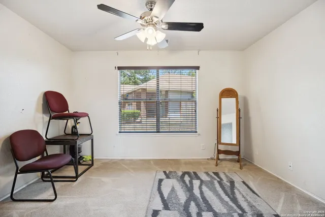 a bed room with a bed and a chair