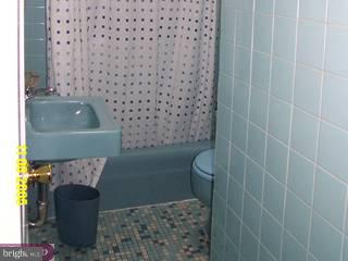 737 Grant Road Folcroft, PA 19032 - Photo 5 of 6 a bathroom with a sink and a mirror